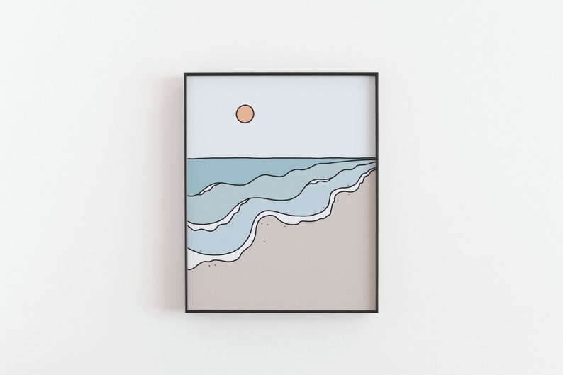 May include: A framed illustration of a beach scene with blue waves crashing on a sandy shore. The sun is a peach color in the sky.