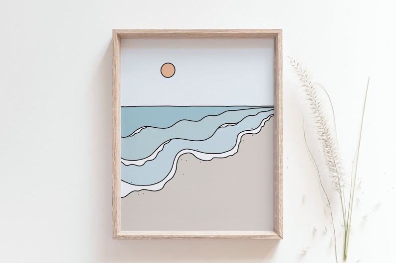 May include: A framed illustration of a beach scene with blue waves crashing on the shore, a light brown sandy beach, and a light orange sun in the sky.