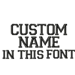 May include: Black embroidered text on a white background. The text reads "CUSTOM NAME IN THIS FONT". The font is a bold, block style, suitable for personalization.