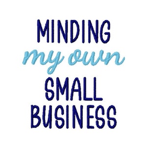 May include: Blue and light blue embroidered text that reads "Minding my own small business".