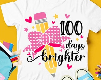 May include: A white t-shirt with a pink bow and a yellow pencil with the text "100 days brighter".