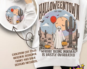 May include: A white sweatshirt with a graphic design of a ghost holding a jack-o-lantern in a desert landscape with cacti. The text "Halloweentown Est. 1998" is above the graphic and the text "Where being normal is vastly overrated" is below the graphic.