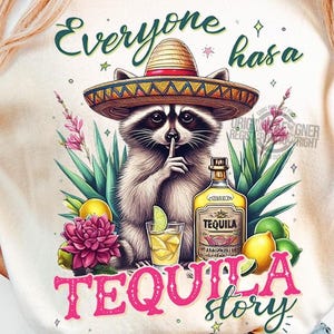 May include: A white t-shirt with a graphic of a raccoon wearing a sombrero and holding a bottle of tequila. The text "Everyone has a Tequila story" is printed on the shirt.