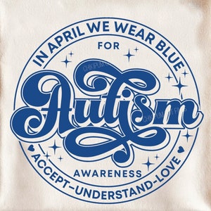 May include: A white t-shirt with a blue circle design that says "In April We Wear Blue For Autism" with stars and hearts around the text. The text "Awareness Accept-Understand-Love" is written around the bottom of the circle.