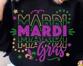 May include: A black sweatshirt with a glittery purple, gold, and green design that says "Mardi Gras".