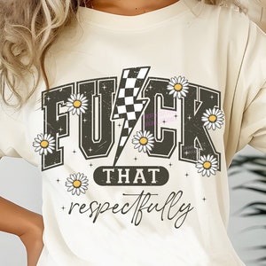 May include: Cream-colored t-shirt with a distressed black graphic that reads "F*CK THAT + respectfully". The graphic includes a lightning bolt and daisy accents. The shirt is a casual, oversized fit.