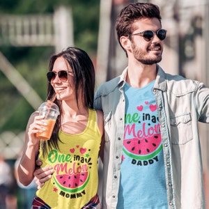 May include: A couple wearing matching watermelon themed tank tops. The woman's tank top says "One in a Melon Mommy" and the man's tank top says "One in a Melon Daddy".