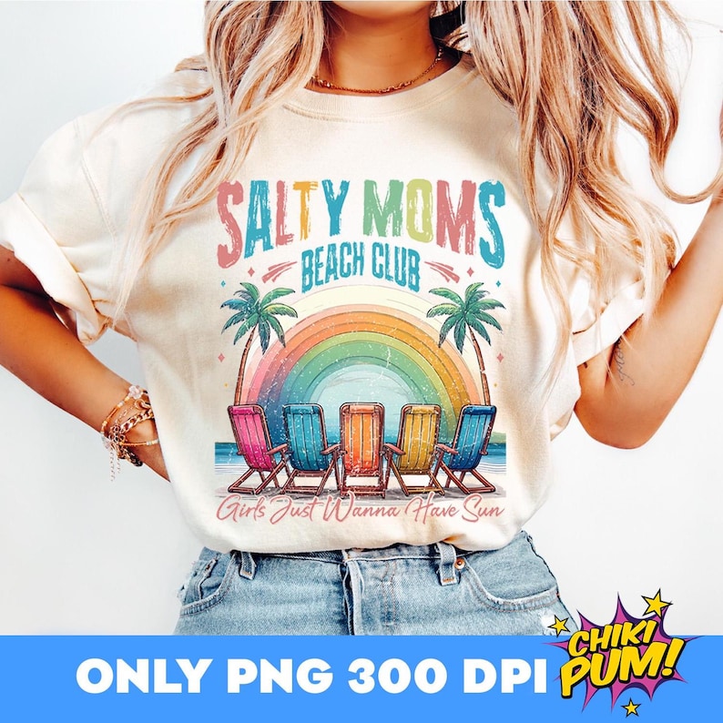 May include: A white t-shirt with a colorful graphic design that says "Salty Moms Beach Club" with a rainbow and beach chairs. The text below the graphic says "Girls Just Wanna Have Sun".