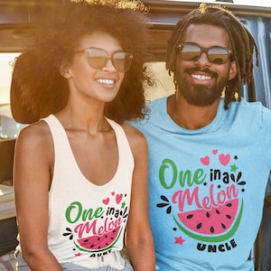 May include: A couple wearing matching watermelon themed shirts. The woman's shirt says "One in a Melon Aunt" and the man's shirt says "One in a Melon Uncle".