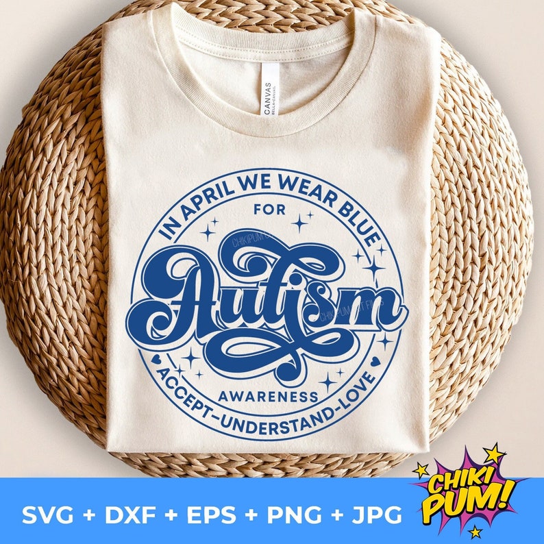 May include: A white t-shirt with a blue circle design that says "In April We Wear Blue For Autism" with stars and hearts around the text. The text "Awareness Accept-Understand-Love" is written around the bottom of the circle.