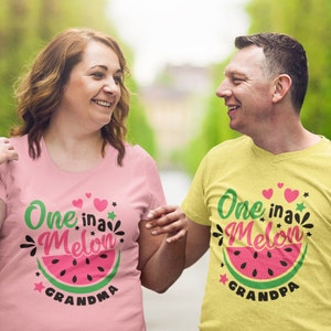 May include: A couple wearing matching pink and yellow t-shirts with the text "One in a Melon" and a watermelon graphic. The woman's shirt says "Grandma" and the man's shirt says "Grandpa".