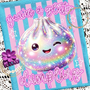May include: A light blue and pink striped t-shirt featuring a holographic, winking dumpling character with the glittery pink text "You're a glitter dumpling". The design includes a purple flower hair claw, gold rings, and a beaded bracelet.