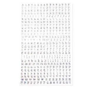 May include: A sheet of clear, adhesive alphabet letters in various fonts. The letters are in a variety of sizes and styles, including uppercase and lowercase. The sheet is rectangular and has a white background.