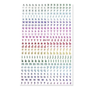 May include: A sheet of alphabet stickers in various colors, including purple, blue, and gold. The stickers feature both uppercase and lowercase letters, with the text "ZS-101" visible. The letters are arranged in neat rows and columns.