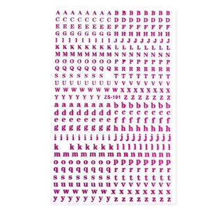 May include: Sheet of purple alphabet letter stickers. The stickers include uppercase and lowercase letters, numbers, and symbols. The letters are in a sans-serif font and are arranged in rows and columns.