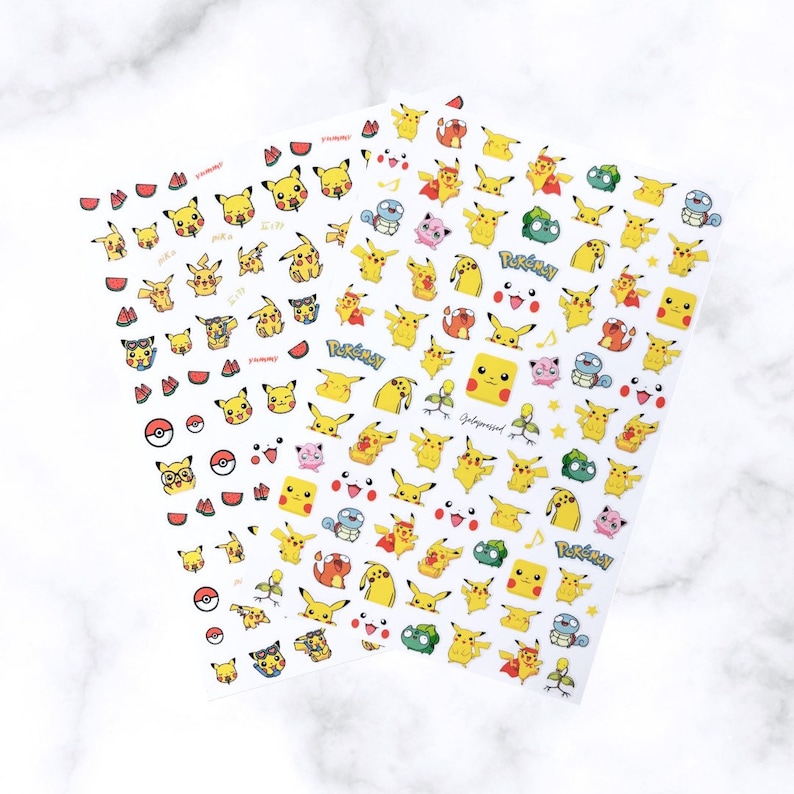 May include: Two sheets of white stickers featuring various yellow Pikachu designs, along with other characters and elements from the Pok&eacute;mon franchise. The stickers include Pikachu in different poses, watermelon slices, and Pok&eacute; Balls.