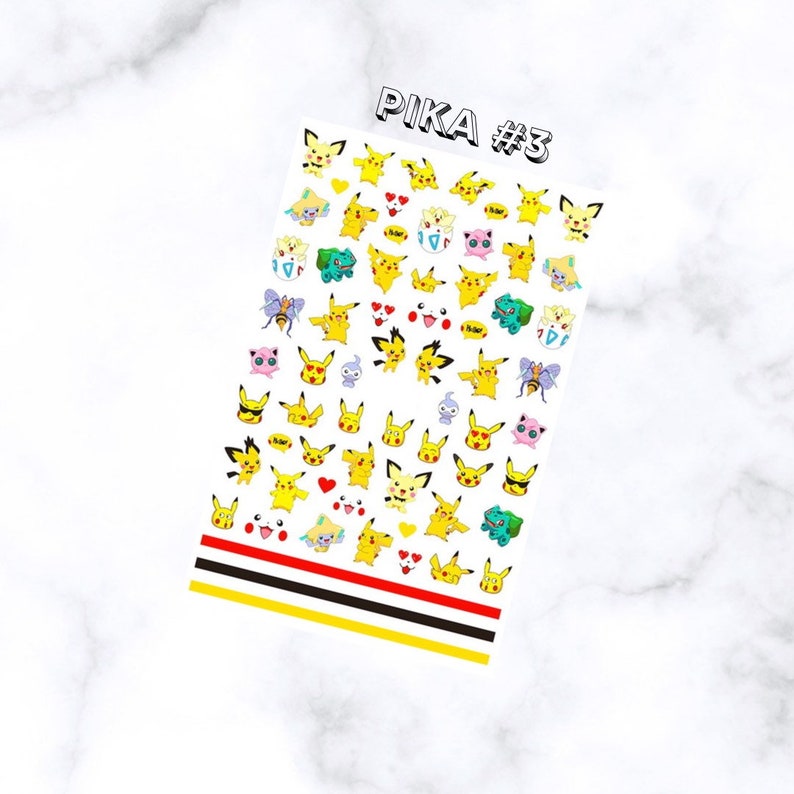 May include: A sheet of nail art stickers featuring various yellow Pikachu designs with hearts and other characters. The sheet has the text "PIKA #3" at the top and red, black, and yellow stripes at the bottom.