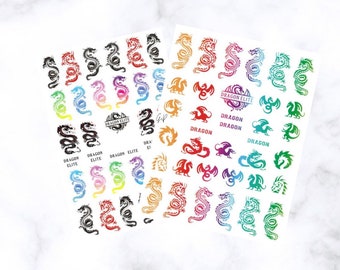 May include: Two sheets of nail art stickers featuring dragon designs in various colors, including red, black, green, and purple. The stickers also include the text "DRAGON ELITE" and the word "DRAGON".