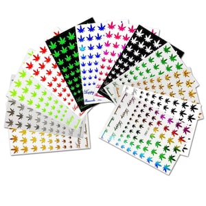 May include: A collection of colorful nail art stickers featuring cannabis leaf designs. The stickers come in various colors, including red, green, black, and gold, with the word "Happy Romantic" printed on some sheets.