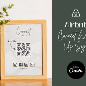 Może przedstawiać: Ramka z białym tłem i czarnym kodem QR. Na ramce widnieje napis "Connect with us" i "Scan Me" ze strzałką wskazującą na kod QR. Pod kodem QR znajdują się ikony dla Instagrama, Facebooka, LinkedIn i poczty elektronicznej. Pod ikonami znajduje się tekst "Get Social". Ramka stoi na drewnianym stole z zieloną rośliną w białym wazonie.