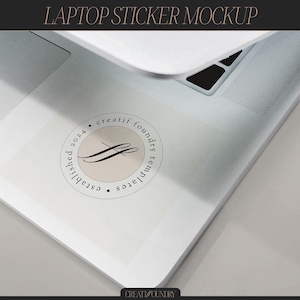 May include: A white laptop with a sticker on the top. The sticker is a circle with the text "creatif foundry templates established 2024" in black text.
