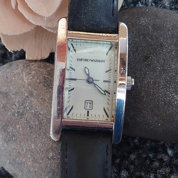 EMPORIO ARMANI model number AR-0103 ladies watch white face in good condition with date window original leather strap keeps good time