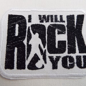 May include: Black and white embroidered patch with the text "I Will Rock You" and a silhouette of a person playing guitar.