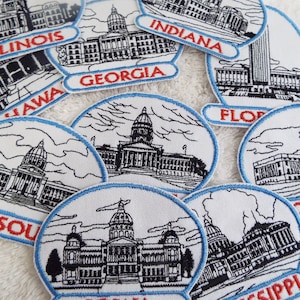 Broderad stryklapp med statshuvudstad