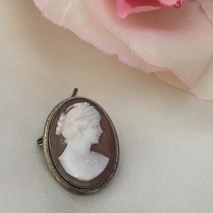 Mollusk Shell Cameo Pin and or Locket Set in Silver Tone. 1900’s Vintage Could be English. Has a Hallmark on the Back. Delicate Carving.