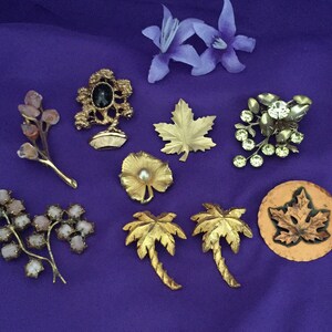 Tree, Leaf and Branch Pin Collection. Total of Nine Pins from the 60’s, 70’s and 80’s. Two of the Branch Pins are Showing Some Age.