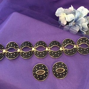 Sixties Chunky Black and Silver Tone Bracelet and Clip Earrings. Weighing 63 Grams. Clips and Clasp Working. Very Jackie O Look.