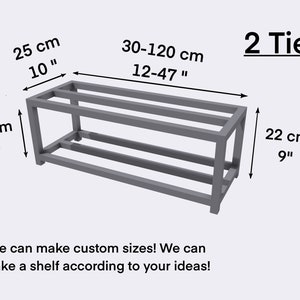 May include: A two-tier metal shelf unit with a gray finish. The shelf is 10 inches wide, 6 inches tall, and 12 to 47 inches long. The shelf is made of metal and has a simple design.  "We can make custom sizes! We can make a shelf according to your ideas!"