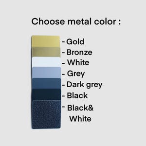 May include: A selection of metal color swatches, including gold, bronze, white, grey, dark grey, black, and black and white.
