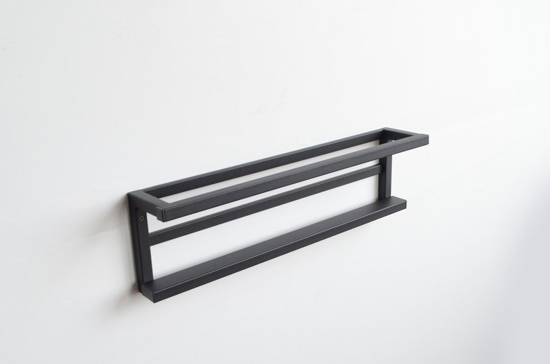 Modern black wall mounted shoe rack with minimalist look