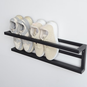 Compact hallway shoe organizer in matte black steel