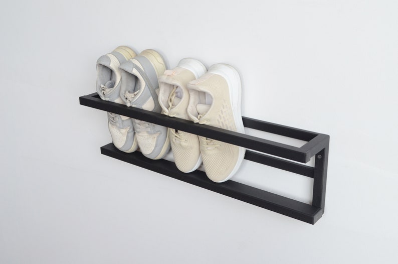 Compact hallway shoe organizer in matte black steel