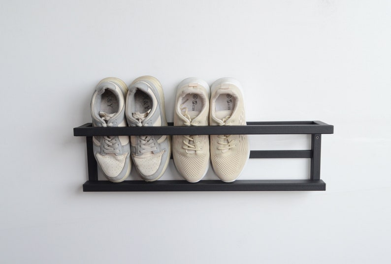 Black wall mounted metal shoe rack for hallway entryway organization