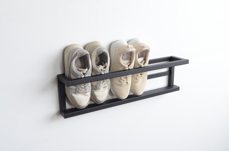 Slim profile black wall shoe shelf for hallway
