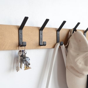 Entryway wall mounted coat rack with metal hooks Industrial hallway storage Black coat hangers Unique wooden towel rail Wood floating shelf