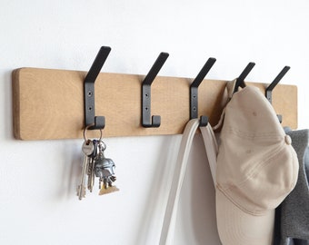 Entryway wall mounted coat rack with metal hooks Industrial hallway storage Black coat hangers Unique wooden towel rail Wood floating shelf