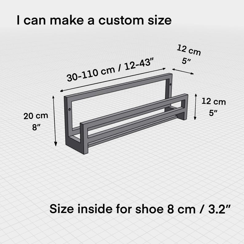 May include: A gray metal shoe rack with two shelves. The rack is 12 inches tall and 30 to 43 inches wide. The inside space for shoes is 8 inches wide. The rack is customizable and can be made in different sizes.
