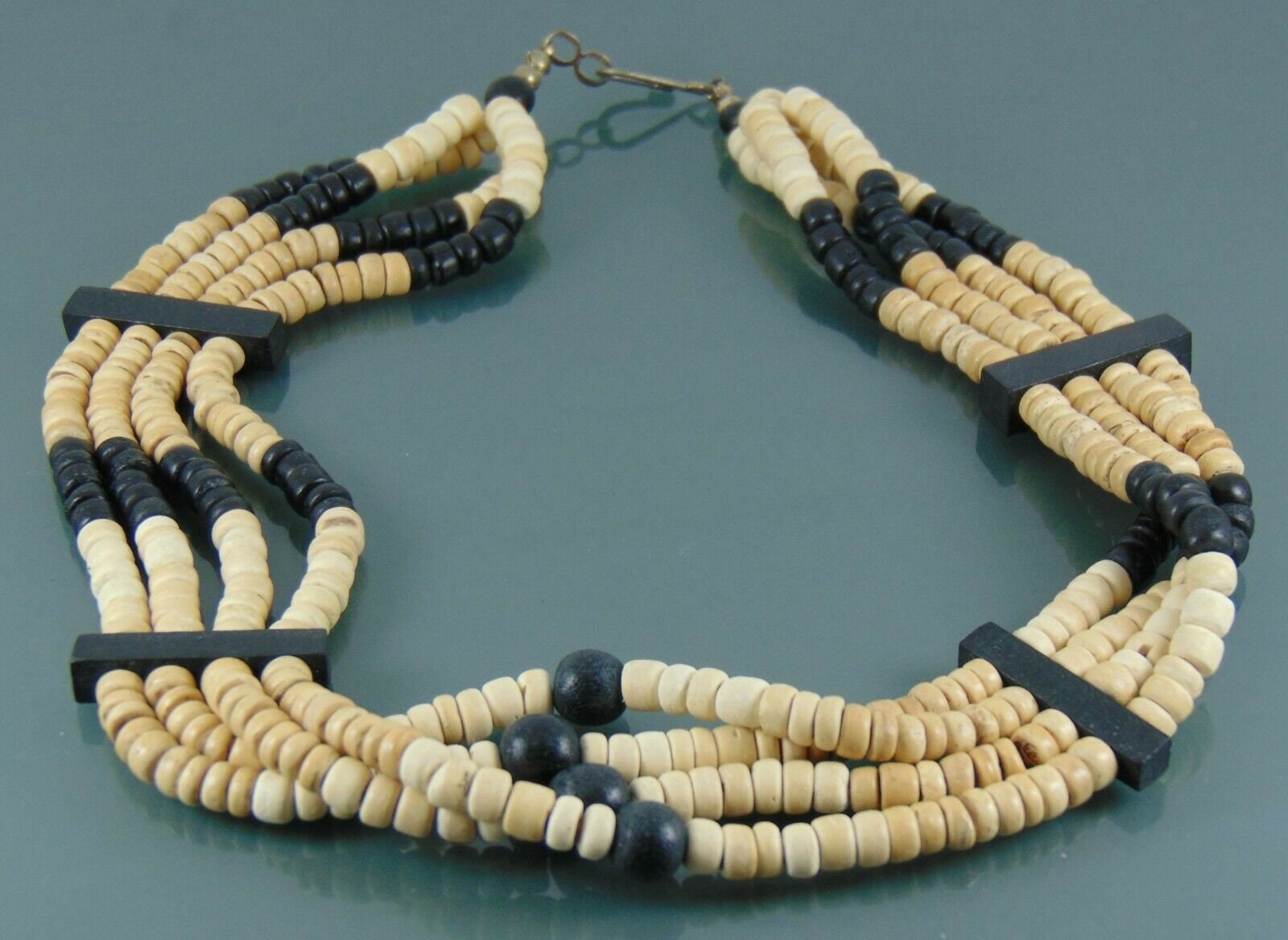 Black and beige necklace with four tiers of ceramic beads and wooden bars Brand new.