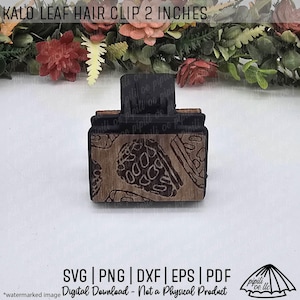 May include: A wooden Kalo leaf hair clip, measuring 5 cm, with a dark brown leaf pattern. The clip has a black clasp. The image includes the text "SVG | PNG | DXF | EPS | PDF" and is a digital download.