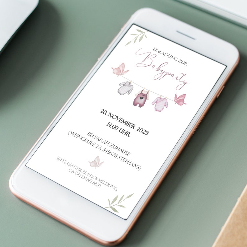 May include: A digital invitation for a baby shower with a pink and gray color scheme. The invitation features a string of clothesline with baby clothes hanging on it and butterflies. The text on the invitation reads "Einladung zur Babyparty" and includes the date, time, and location of the party.