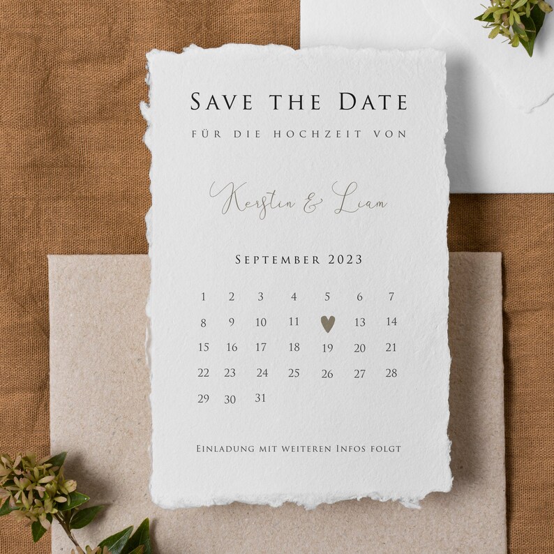 May include: Save the date card with a calendar for September 2023. The date September 19th is marked with a heart. The card says "Save the Date" and "For the wedding of Kerstin & Liam".