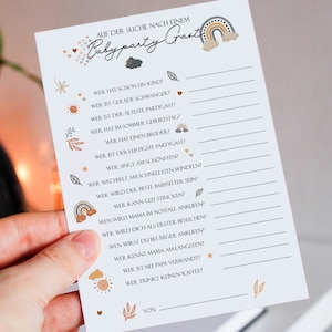 May include: A printable baby shower game in a light blue color with brown and orange accents. The game is called "Baby Party Guest" and asks a series of questions about the guests, such as who has a child, who is pregnant, who is the oldest, and who has a brother. The game is designed to be played at a baby shower.