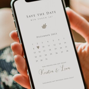 May include: A digital save the date card with a calendar showing December 2023 with a heart on the 9th. The text reads "Save the Date, Wir sagen Ja!" and "Wir freuen uns auf euch! Kerstin & Liam".