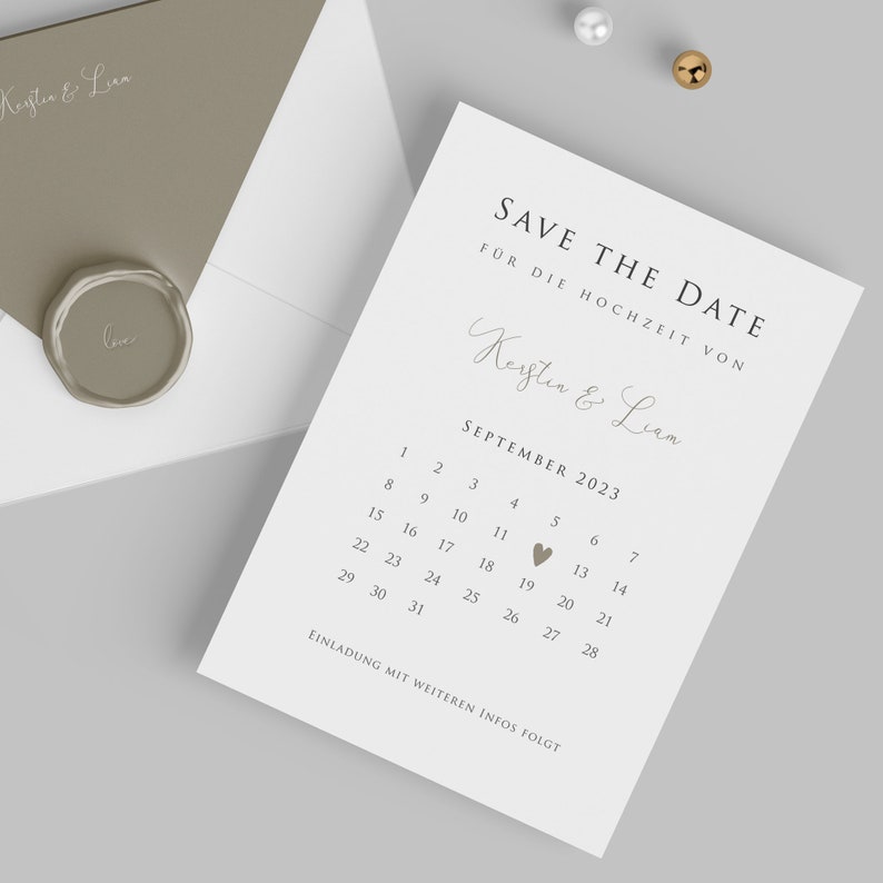 May include: Save the date card with a calendar for September 2023. The date of the wedding is marked with a heart on the 19th. The card says "Save the Date" and "For the wedding of Kerstin & Liam".