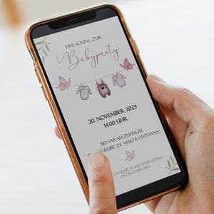 May include: A digital invitation for a baby party on November 20th at 2:00 PM. The invitation features a line of clothes hanging on a clothesline with pink butterflies and the text "EINLADUNG ZUR Babyparty".