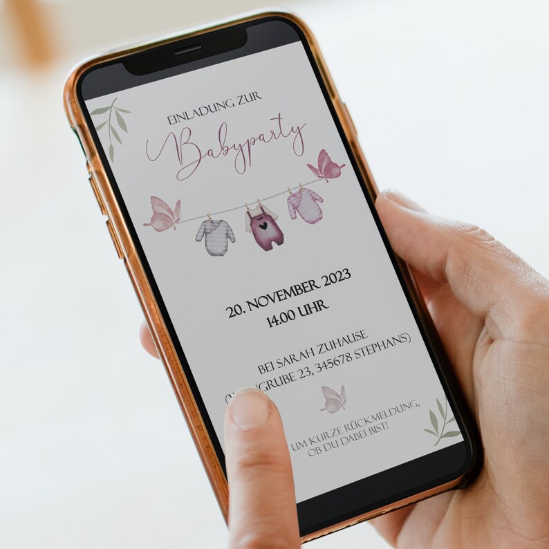 May include: A digital invitation for a baby party on November 20th at 2:00 PM. The invitation features a line of clothes hanging on a clothesline with pink butterflies and the text "EINLADUNG ZUR Babyparty".